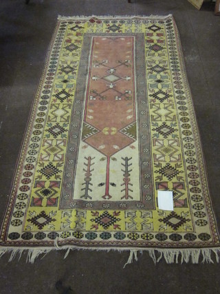 A contemporary Caucasian style carpet, the central medallion within multi row borders 84" x 46"