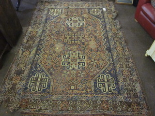 An Eastern carpet, heavily worn and with holes, 110" x 76"