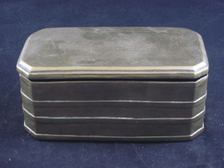 An Eastern engraved brass lozenge shaped box with hinged lid 7"