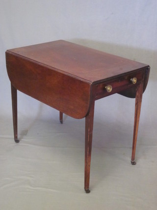A 19th Century mahogany Pembroke table fitted a drawer and  raised on square tapering supports ending in brass caps and castors 32"