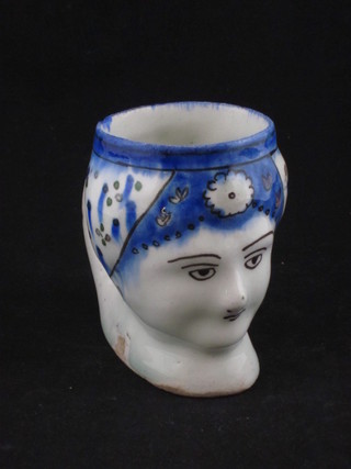 A Persian pottery jug in the form of a portrait bust of a lady 4  1/2", slight crack,