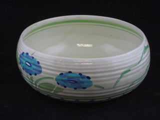 A Clarice Cliff circular green glazed bowl with blue floral  decoration, the base with black Clarice Cliff mark and 632S/S,  7"