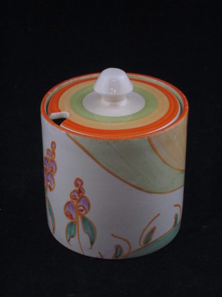 A Clarice Cliff Fantasque pattern cylindrical preserve jar and  cover, 3"  ILLUSTRATED