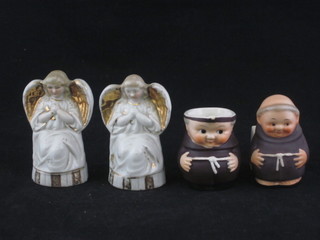 2 candle snuffers in the form of Angels, a miniature Goebel jug decorated a monk, chip to rim, and 1 other figure of a monk