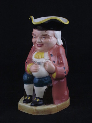 A pottery Toby jug, the base fitted a musical box movement 9"