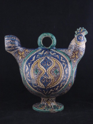 A Persian pottery ewer in the form of a cockerel, raised on a spreading foot 10"