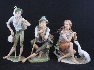 3 Bavarian porcelain figures - seated girl with goose, boy with flute and Papagano 9"