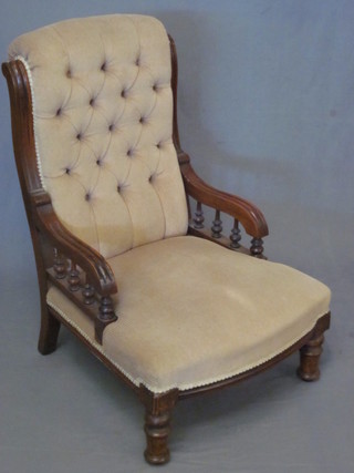 A Victorian mahogany show frame nursing chair with bobbin  turned decoration, upholstered in brown corduroy material on  turned supports