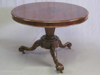 A Victorian circular mahogany snap top breakfast table, raised on  a chamfered column and triform base, 41"