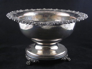 A circular silver plated pedestal bowl raised on 3 paw feet 11"