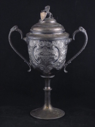 A Victorian embossed Britannia metal twin handled trophy cup