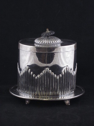 An oval Britannia metal caddy with demi-reeded decoration 6"