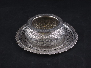 An Eastern circular pierced white metal dish and a ditto bowl