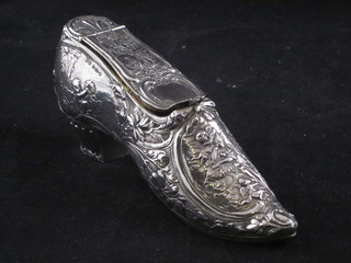 A Continental embossed silver trinket box in the form of a ladies shoe, 4 ozs