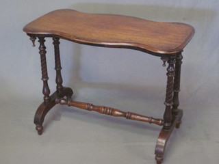 A Victorian shaped mahogany stretcher table, raised on 4 turned  columns with H framed stretcher 35"