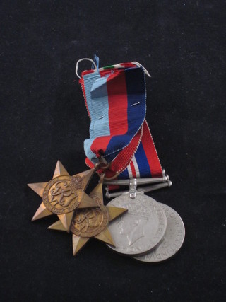 A group of 3 medals comprising 1939-45 Star, Italy Star, British  War medal and 1 other WWII British war medal