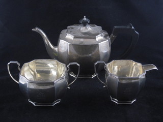 A silver 3 piece tea service of octagonal form comprising teapot, twin handled sugar bowl and cream jug, London 1931 and 1935,  by Mappin & Webb, 33 ozs  ILLUSTRATED