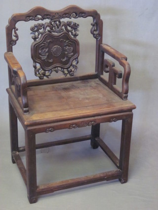 An Oriental carved and pierced Padouk throne chair with solid  seat
