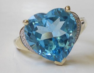 A 14ct yellow gold dress ring set a heart shaped topaz