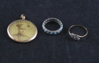 A gold double sided photo locket together with 2 dress rings