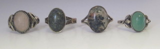 4 silver rings set cabouchon cut hardstones