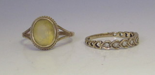 A lady's 9ct gold dress ring set a yellow stone together with a  gold half eternity ring