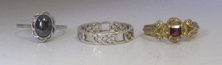 A gilt metal dress ring and 2 other dress rings