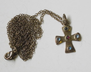 A gilt metal cross set hardstones, hung on a fine chain
