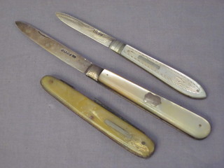 2 folding fruit knives with silver blades and mother of pearl  mounts and 1 other