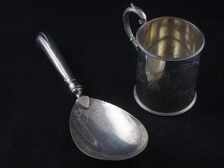 A Continental silver serving spoon and a silver plated tankard