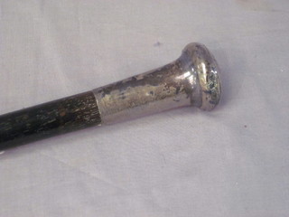 An ebony walking cane with silver band