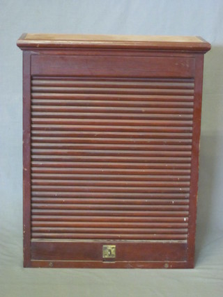 A Victorian mahogany cabinet enclosed by a tambour shutter 23"