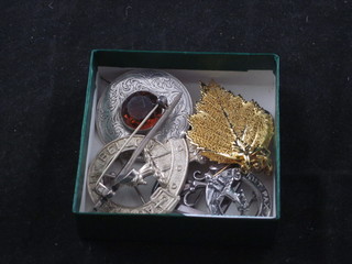 A silver brooch, a Scots silver brooch, 2 clan brooches, a sword brooch and a pair of gilt metal earrings