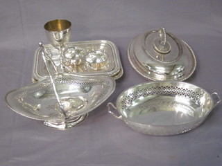 An oval silver plated entree dish and cover, 1 other - no handle  and 2 entree dish bases, a cake basket etc