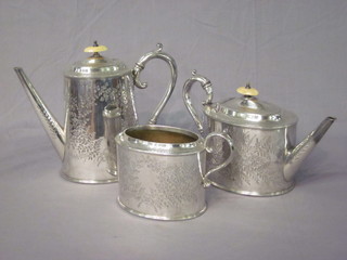 A Victorian Britannia metal 3 piece tea/coffee service with oval engraved teapot, coffee pot and twin handled sugar bowl - 1  handle missing