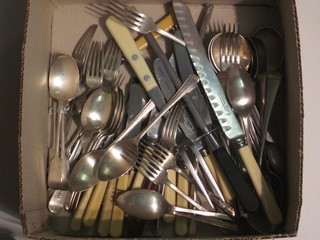 A box containing a collection of silver plated flatware
