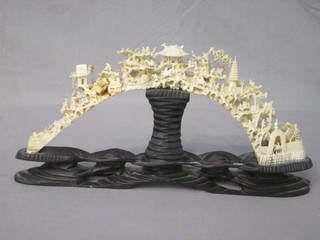 An ivory bridge carved various figures and buildings etc 14", f and r,