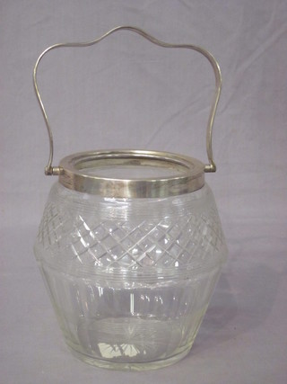 A cut glass biscuit barrel with silver mount, missing lid,
