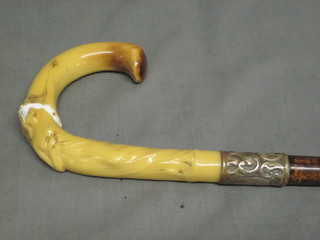 An Art Nouveau style walking stick with plastic handle