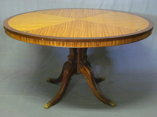 A Georgian style Kingwood and mahogany circular breakfast table with crossbanded top, raised on pillar and tripod supports  53"