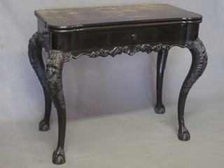 An Anglo Indian carved Coromandel tea table fitted 3 short  drawers, raised on cabriole ball and claw supports 33"   ILLUSTRATED