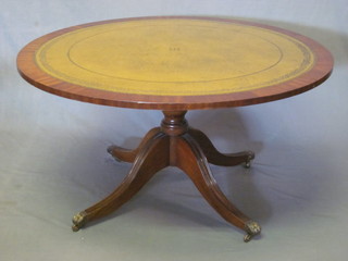 A Georgian style circular mahogany pedestal coffee table with  green inset surface, raised on a pillar and tripod base 39 1/2"