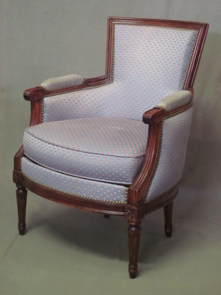 A pair of mahogany show frame chairs with upholstered seats and backs, raised on turned supports