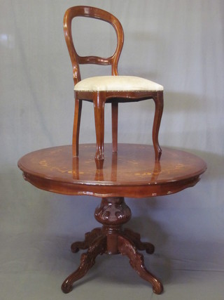 A Victorian style mahogany dining suite comprising circular pedestal dining table and 4 balloon back dining chairs