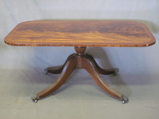 A Georgian style mahogany coffee table, raised on pillar and tripod supports 48"
