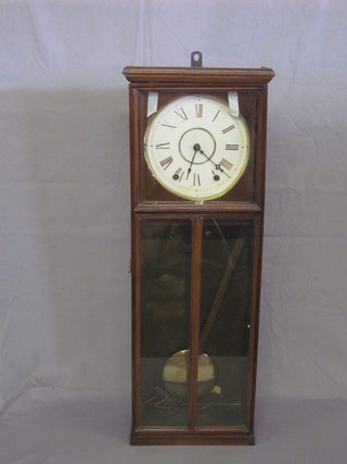 A striking hanging wall clock with 8 1/2" paper dial contained in  a mahogany case
