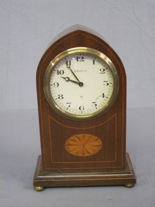 An 8 day bedroom timepiece with paper dial and Arabic numerals contained in an inlaid mahogany lancet case