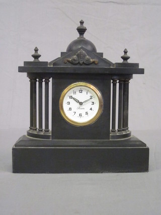 A Victorian architectural mantel clock with paper dial and Arabic  numerals contained in a black marble case