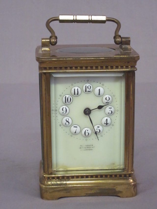A Victorian carriage clock with enamelled dial and Arabic numerals by Russells of Liverpool  ILLUSTRATED