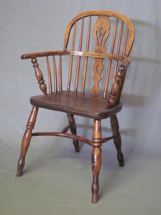 A 19th Century yew and elm Windsor carver chair with cow  horn stretcher  ILLUSTRATED